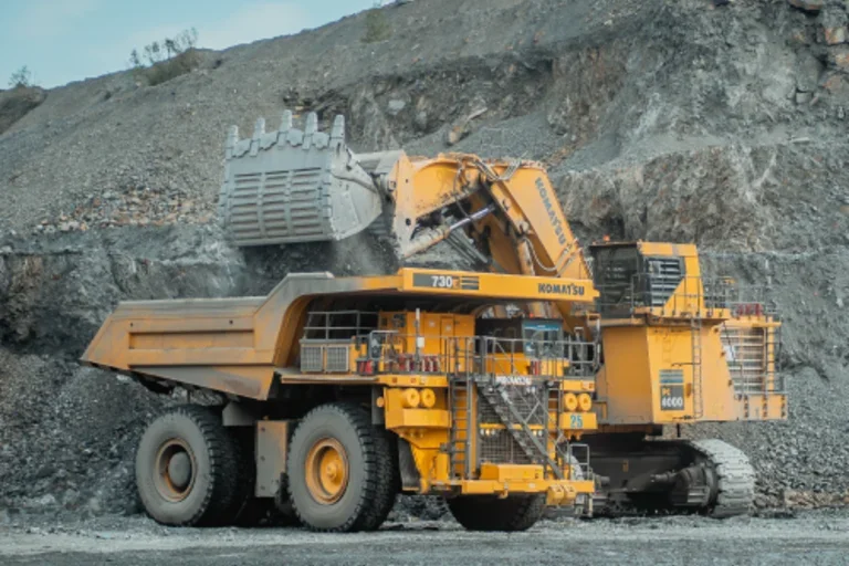 Yellow digger vehicle in mining operation