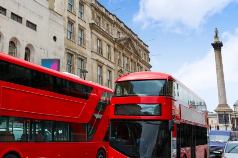 Red bus driving through London